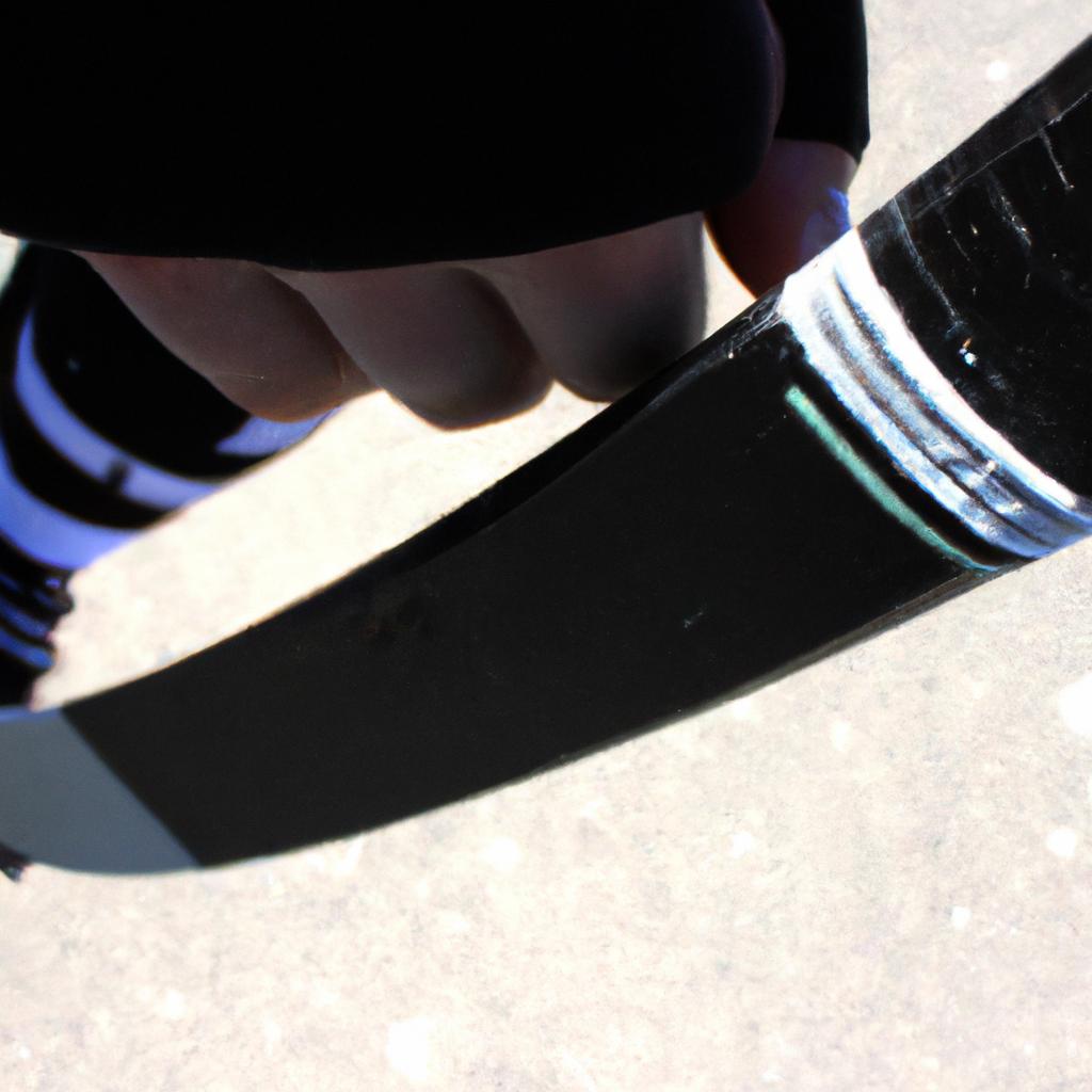 Person holding hockey stick, skating