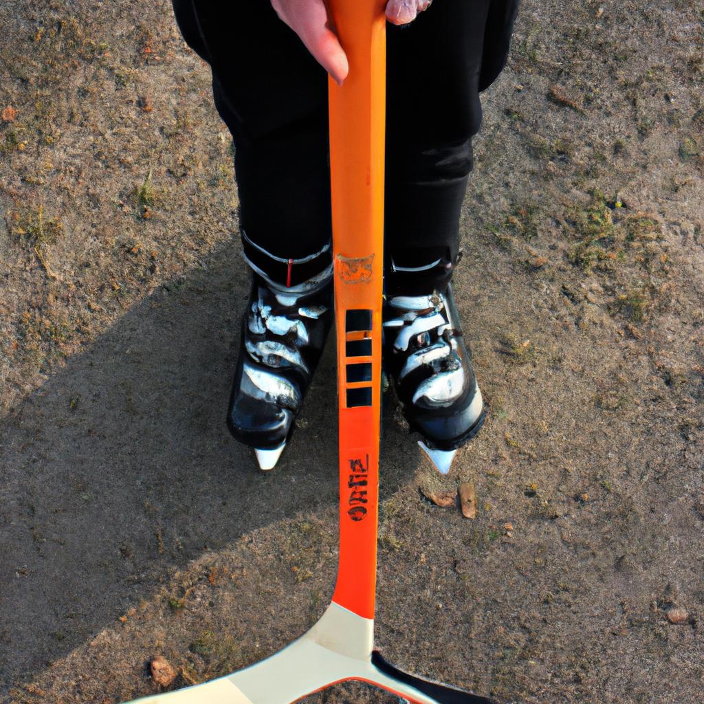 Person holding hockey stick, skating